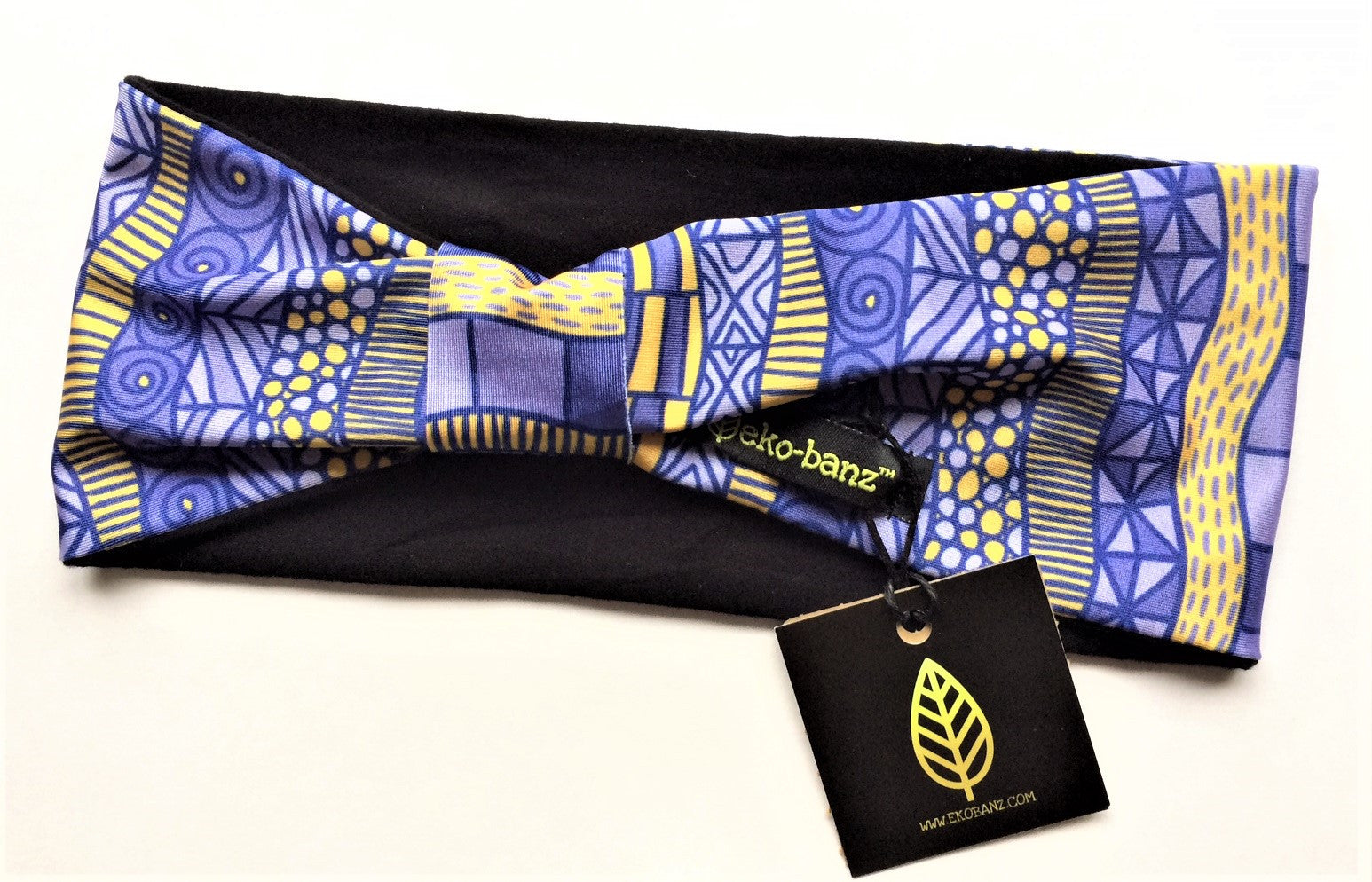 Soft and luxurious, yoga headband made from sustainable bamboo and performance lycra. Purple and gold geometric pattern weave their way around the headband.